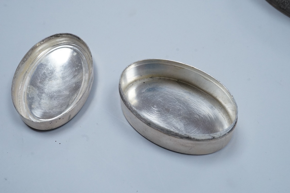 A continental 935 standard white metal oval box, with inset frosted glass and marcasite set hinged cover, 82mm, together with three assorted small pill boxes, including enamelled(a.f.), an Italian 800 standard and a mode
